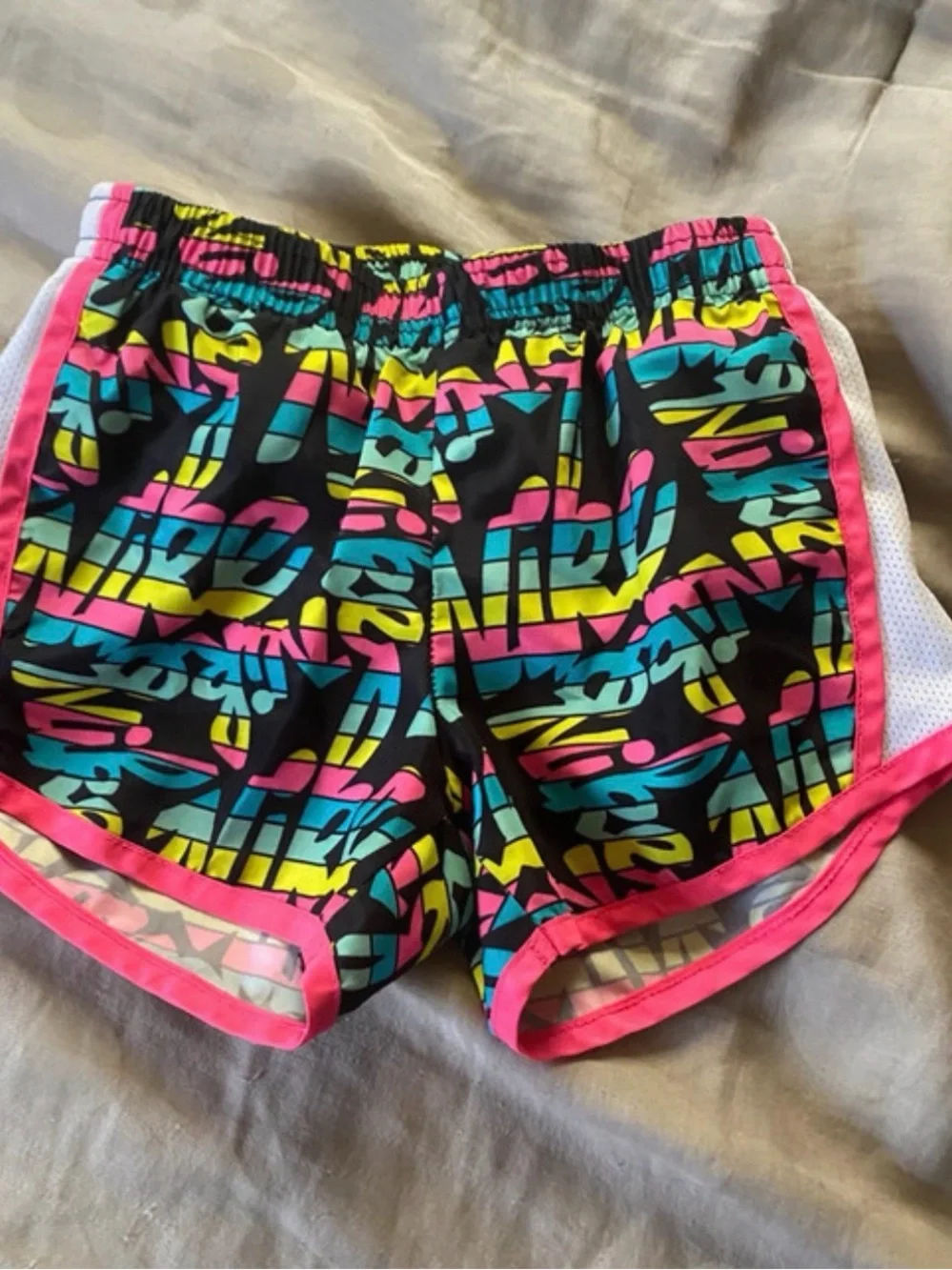 Nike Girls Black Athletic Shorts with Pink, Teal & Yellow Graphic